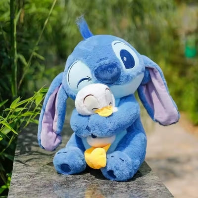 Peluche Stitch bleu et son doudou canard
