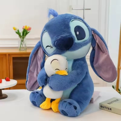 Peluche Stitch bleu et son doudou canard