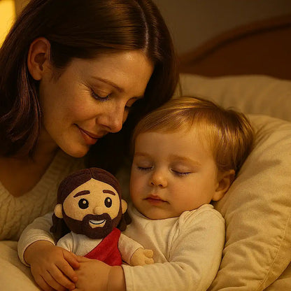 Bébé endormi tenant la peluche réconfortante Jésus de Nazareth, doudou bébé doux et sécurisant