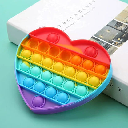 Jouet sensoriel en silicone arc-en-ciel