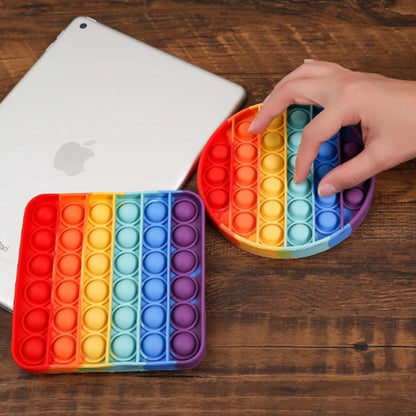 Jouet sensoriel en silicone arc-en-ciel