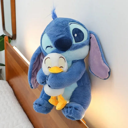 Peluche Stitch bleu et son doudou canard