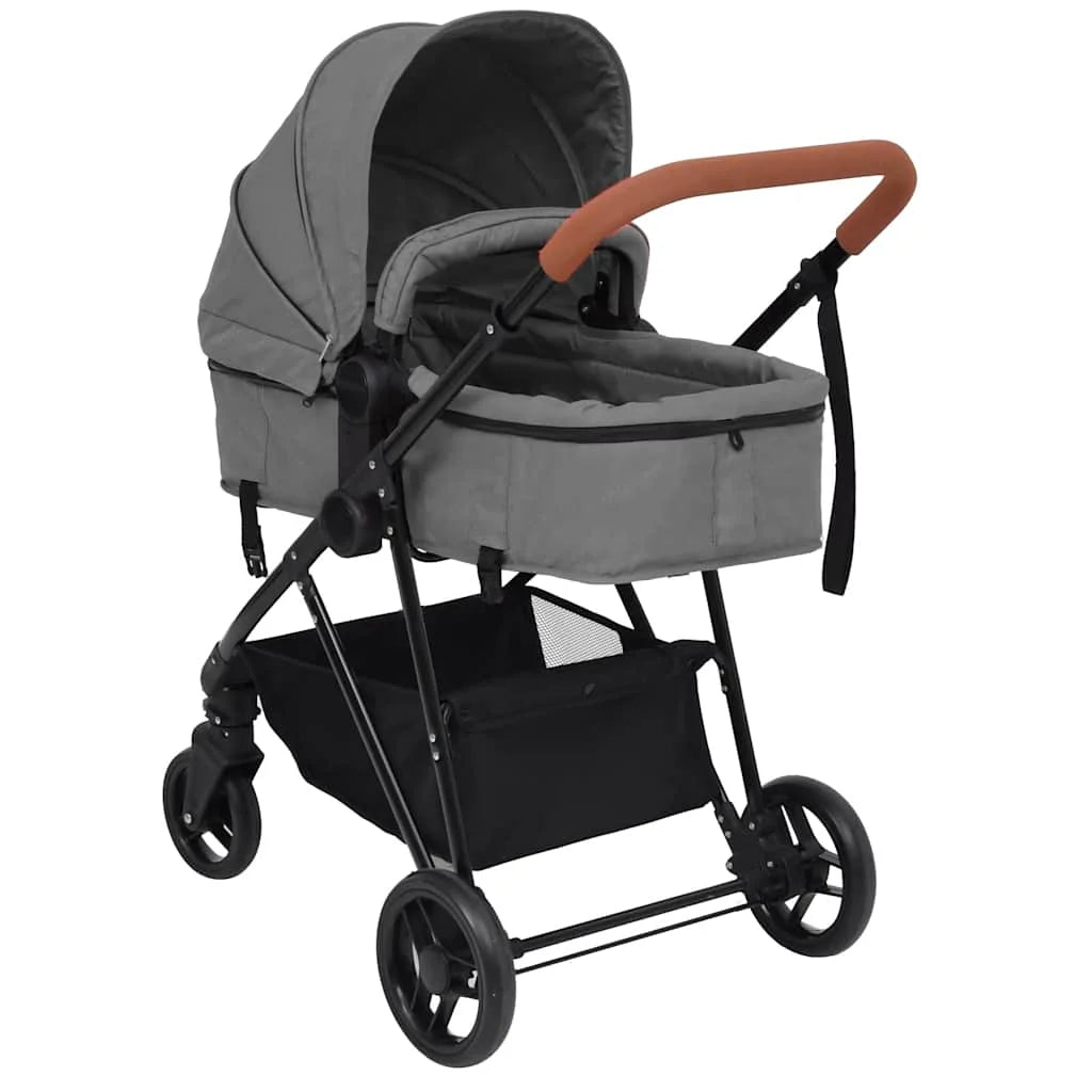 Poussette 2 en 1 coloris gris, vue trois quarts avant avec nacelle, capote fermee et quatre roues - Choupinoo