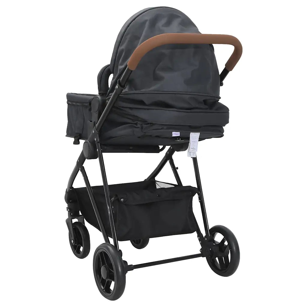 Poussette 2 en 1 transformable en berceau coloris noir, configuration nacelle, vue arriere avec guidon caramel et panier de rangement - Choupinoo